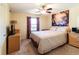 Bright bedroom features a ceiling fan, window, and carpeted floor at 1830 Brandy Se Ln, Conyers, GA 30013