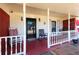 Inviting front porch with a swing and seating, perfect for relaxing outdoors at 1830 Brandy Se Ln, Conyers, GA 30013
