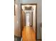 Hallway with hardwood floors leading to the bedrooms and bathrooms at 1830 Brandy Se Ln, Conyers, GA 30013