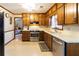 Bright kitchen with stainless steel appliances and wooden cabinets at 1830 Brandy Se Ln, Conyers, GA 30013