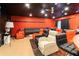 Finished basement living room with seating, a ceiling fan and dark ceiling at 1830 Brandy Se Ln, Conyers, GA 30013