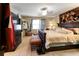 Comfortable main bedroom featuring a large bed, bench, and carpeted floors at 1830 Brandy Se Ln, Conyers, GA 30013