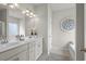 Bright bathroom features double sink vanity, decorative wall art, and neutral color palette at 295 Cranston Dr, Canton, GA 30114