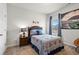 Comfortable bedroom features a baseball theme, framed art, and natural light from the window at 295 Cranston Dr, Canton, GA 30114