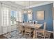 Elegant dining room featuring a modern chandelier, a bright window and stylish décor accents at 295 Cranston Dr, Canton, GA 30114