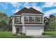 Charming two-story home featuring symmetrical window designs and a welcoming attached two-car garage at 295 Cranston Dr, Canton, GA 30114