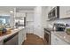 Contemporary kitchen with stainless steel appliances, granite countertops, and ample cabinet space at 295 Cranston Dr, Canton, GA 30114
