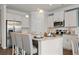 Bright kitchen with stainless steel appliances, granite countertops, and a breakfast bar with seating for three at 295 Cranston Dr, Canton, GA 30114