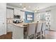 Modern kitchen featuring stainless steel appliances, granite countertops, and a stylish blue accent wall at 295 Cranston Dr, Canton, GA 30114