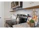 Close-up of kitchen featuring granite countertops, stainless steel appliances, and decorative elements at 295 Cranston Dr, Canton, GA 30114