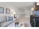 Upstairs living area featuring comfortable seating, artwork, and a built-in media center at 295 Cranston Dr, Canton, GA 30114
