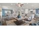 Open-concept living room and dining room featuring hardwood floors and neutral tones at 295 Cranston Dr, Canton, GA 30114