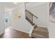 Carpeted staircase featuring hardwood accents and leading to the upper level of the home at 295 Cranston Dr, Canton, GA 30114