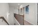 Hallway with wooden bannister, neutral paint, and carpet at 295 Cranston Dr, Canton, GA 30114
