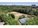 Aerial view featuring ball field, tennis court, playground, and a city skyline at 311 Peachtree Hills Ne Ave # 10C, Atlanta, GA 30305