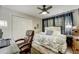 Bright bedroom with office area featuring a comfy chair, closet, and natural light at 311 Peachtree Hills Ne Ave # 10C, Atlanta, GA 30305