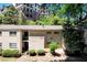 Apartment building featuring brick facade and landscaped grounds at 311 Peachtree Hills Ne Ave # 10C, Atlanta, GA 30305