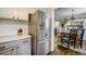 Bright kitchen with stainless steel refrigerator and view into dining area at 311 Peachtree Hills Ne Ave # 10C, Atlanta, GA 30305