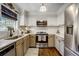 Well-lit kitchen featuring stainless steel appliances, neutral cabinetry, and granite countertops at 311 Peachtree Hills Ne Ave # 10C, Atlanta, GA 30305