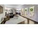 Inviting living room with hardwood floors, a comfy couch, a balcony, and stylish decor at 311 Peachtree Hills Ne Ave # 10C, Atlanta, GA 30305
