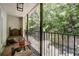 Charming patio surrounded by lush greenery and trees, offering serene privacy at 311 Peachtree Hills Ne Ave # 10C, Atlanta, GA 30305