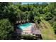 Aerial view of community swimming pool with ample lounge chairs and verdant surroundings at 311 Peachtree Hills Ne Ave # 10C, Atlanta, GA 30305