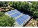 Aerial view of community tennis courts, offering a recreational amenity for residents at 311 Peachtree Hills Ne Ave # 10C, Atlanta, GA 30305