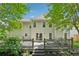 Spacious backyard featuring an expansive deck, perfect for outdoor entertaining and relaxation at 6034 Farmwood Se Way, Mableton, GA 30126