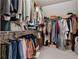 Organized walk-in closet with ample storage space for clothes and accessories at 6034 Farmwood Se Way, Mableton, GA 30126