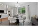 Cozy dining area adjacent to the living room with sliding glass doors leading to the outdoor space at 6034 Farmwood Se Way, Mableton, GA 30126