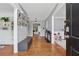 Inviting home entryway with hardwood floors, a built-in bookcase, and stylish decor at 6034 Farmwood Se Way, Mableton, GA 30126
