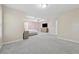 Spacious main bedroom with carpet, featuring a tray ceiling, ceiling fan, and modern furnishings at 6034 Farmwood Se Way, Mableton, GA 30126