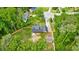 Aerial view of a home surrounded by lush green trees at 1384 Sunrise Way, Lawrenceville, GA 30046