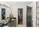 A clean bathroom featuring double sinks with dark counters and a view into a walk-in closet at 1384 Sunrise Way, Lawrenceville, GA 30046
