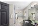 A serene bathroom featuring a bathtub with shower, sleek black hardware, and a spacious vanity at 1384 Sunrise Way, Lawrenceville, GA 30046