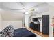 This room features a plush bed, plenty of space, and a TV mounted on the wall for entertainment at 1384 Sunrise Way, Lawrenceville, GA 30046