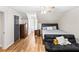 This bedrom offers ample storage and a sleeping and sitting area, perfect for relaxation and organization at 1384 Sunrise Way, Lawrenceville, GA 30046