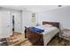 Bedroom is complete with wood floors, ample natural light, and closet space at 1384 Sunrise Way, Lawrenceville, GA 30046