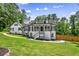 Charming two-story home with a inviting front porch and a well-manicured lawn at 1384 Sunrise Way, Lawrenceville, GA 30046
