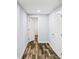 Hallway showing freshly painted walls, and beautiful wood-look floors at 1384 Sunrise Way, Lawrenceville, GA 30046