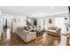 Cozy living room with hardwood floors, natural light and a fireplace at 1384 Sunrise Way, Lawrenceville, GA 30046