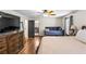 A comfortable bedroom featuring hardwood floors and a daybed, with a black door leading to the bathroom at 1384 Sunrise Way, Lawrenceville, GA 30046