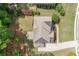 Aerial view of the home and it's well-manicured, landscaped yard and surrounding greenery at 3230 Sundew Nw Dr, Acworth, GA 30101
