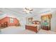 Spacious bedroom featuring a trey ceiling, large windows with decorative curtains, and comfortable furniture at 3230 Sundew Nw Dr, Acworth, GA 30101