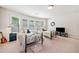 Bright bedroom features two twin beds with metal frames and large windows at 3230 Sundew Nw Dr, Acworth, GA 30101