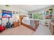 Unique bedroom with fun decor, decorative plants, and natural light from the window at 3230 Sundew Nw Dr, Acworth, GA 30101
