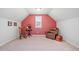Bonus room featuring a rocking chair, recliner, carpet flooring, and a large window at 3230 Sundew Nw Dr, Acworth, GA 30101