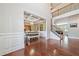 Open-concept dining area with a coffered ceiling, chandelier, and hardwood floors at 3230 Sundew Nw Dr, Acworth, GA 30101