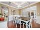 Inviting dining room with a wooden table, chandelier, and hardwood floors at 3230 Sundew Nw Dr, Acworth, GA 30101