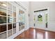 Elegant foyer featuring hardwood floors, French doors, and abundant natural light at 3230 Sundew Nw Dr, Acworth, GA 30101